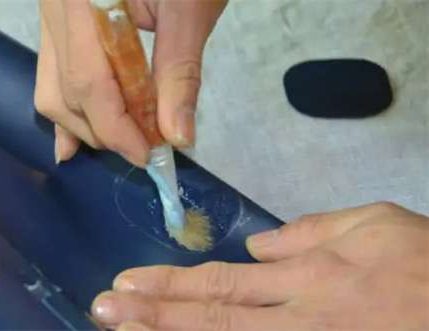 Applying PVC adhesive glue with small brush