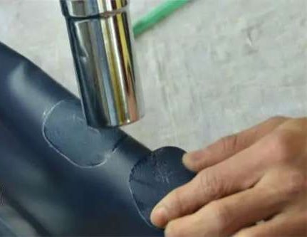 Using heat gun to warm PVC surface before adhesive application