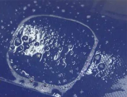 Soapy water spray test for detecting air leaks on commercial inflatable