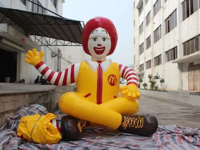 Front view of PVC inflatable Ronald McDonald figure with waving arm and painted face detail