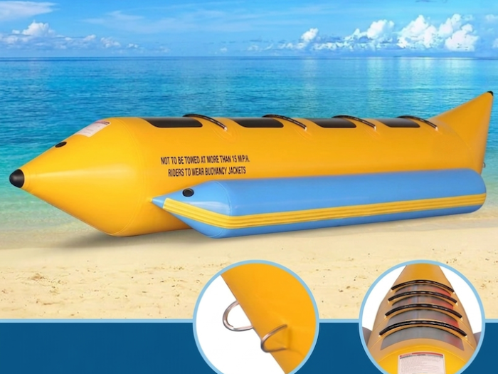Yellow and blue inflatable banana boat with stainless-steel D-rings and 4 separate seats, beach background