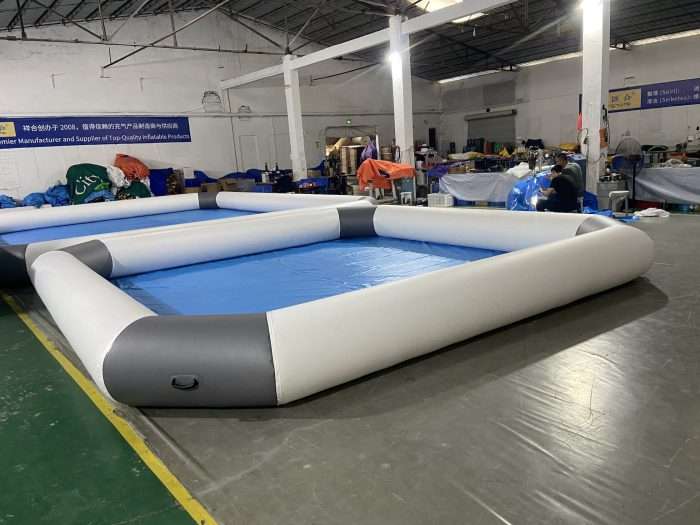 Square inflatable pool with gray and white walls in a manufacturing warehouse, 6x6m